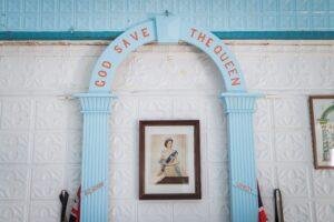 a blue arch with a picture of a man on it